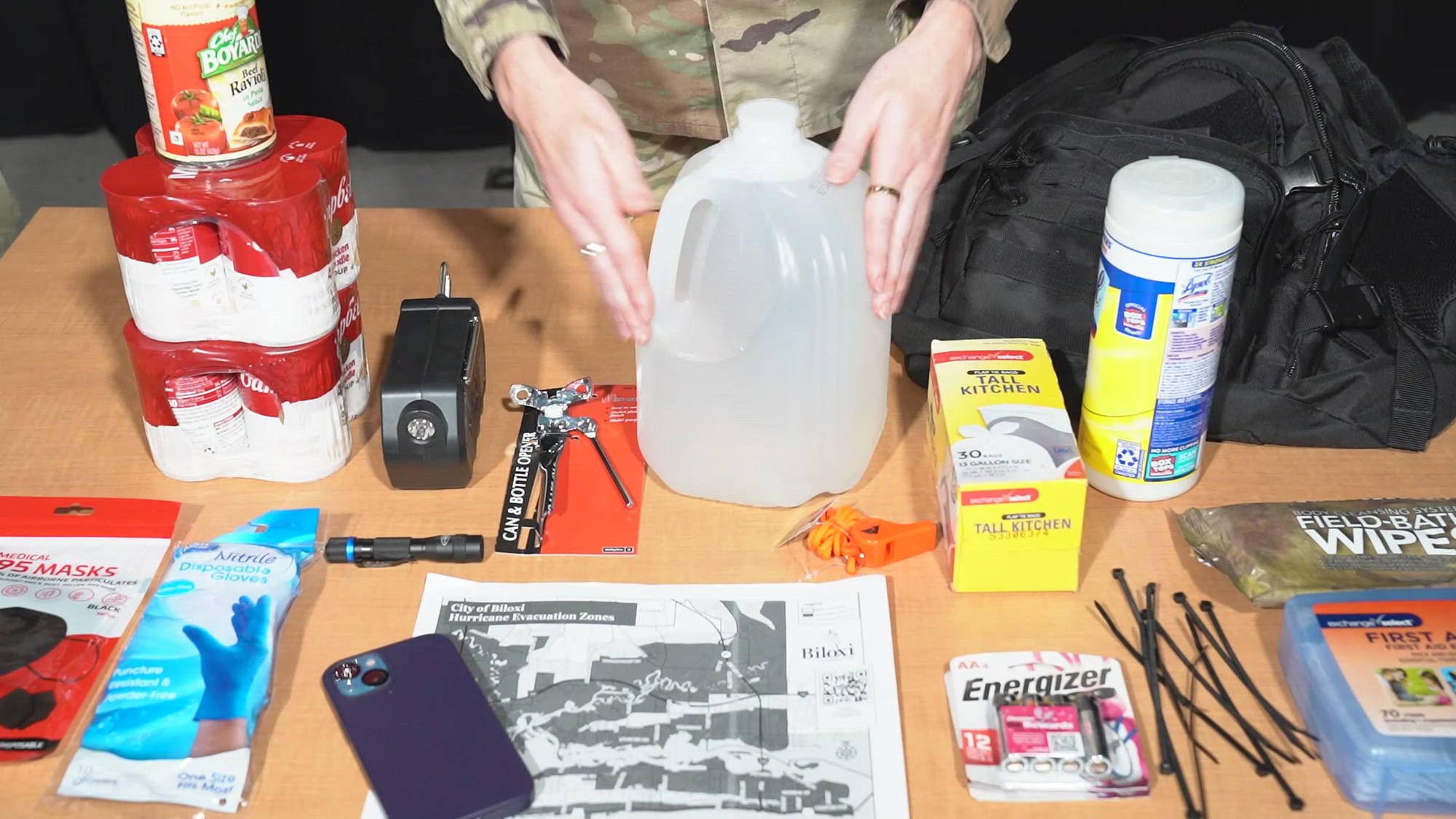 U.S. Air Force Airman 1st Class Devyn Waits, 81st Training Wing public affairs specialist, gives a tutorial on the types of items needed to build a hurricane kit on Keesler Air Force Base, Mississippi, April 30, 2024. 