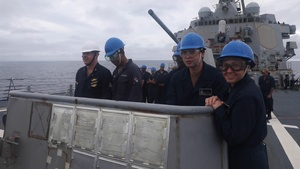 Sailors aboard the USS Howard conduct a sea and anchor detail in Okinawa, Japan