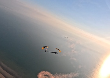 Soldiers from Army Golden Knights jump onto Utah Beach in Normandy, France for D-Day commemoration ceremonies