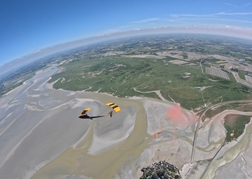 Soldiers from Army Golden Knights jump at Mont Saint- Michel Normandy, France for D-Day commemoration ceremonies