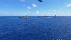 USS Ronald Reagan (CVN 76) steams in formation with 7th Fleet ships, Japan Maritime Self-Defense Force ships, as U.S. Navy, U.S. Air Force and Japan Air Self-Defense Force aircraft fly over in support of Valiant Shield 2024