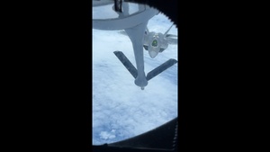 KC-135 Stratotanker refuels F-22 Raptors