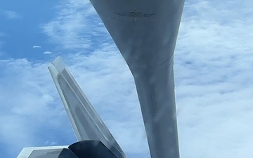KC-135 Stratotanker refuels F-22 Raptors
