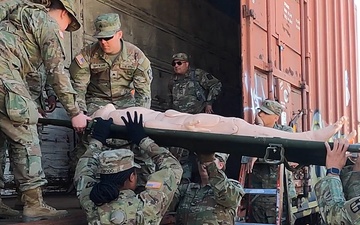 Army Reserve Soldiers train with patient transfer to boxcar