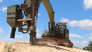 106th Engineer Detachment Soldiers drill holes for explosives on troop project at Fort McCoy, Part 4