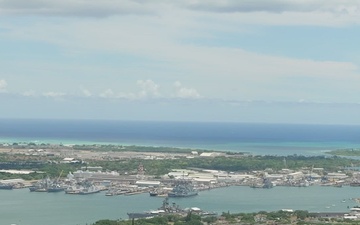 Aerial view of ships moored at Pearl Harbor and Ford Island during RIMPAC 2024
