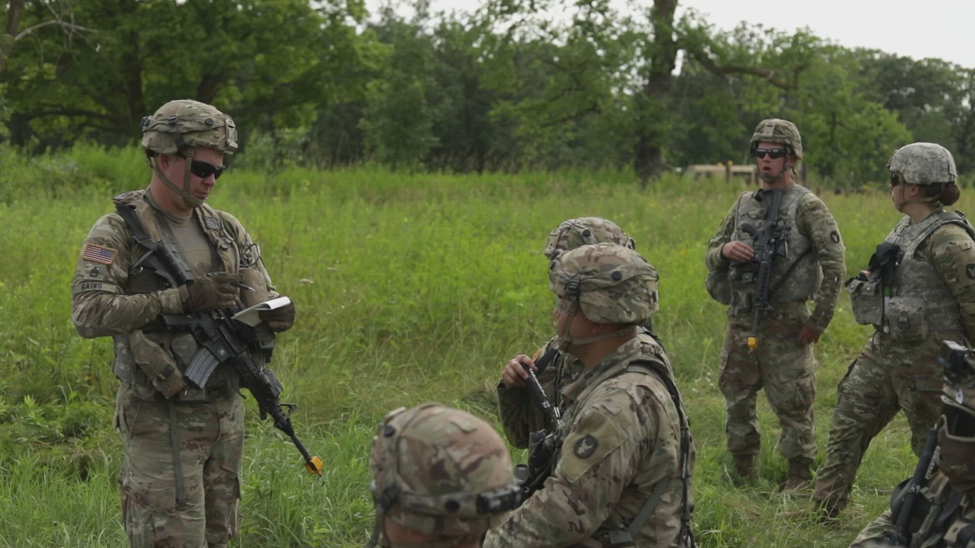 Soldiers from the 1st Battalion, 194th Field Artillery Regiment, 2nd Brigade Combat Team, 34th Infantry Division, Iowa Army National Guard, receive a convoy briefing and drive High Mobility Multipurpose Wheeled Vehicles, Medium Tactical Vehicles, and Heavy Expanded Mobility Tactical Trucks along a roadway and react to simulated enemy rifle fire and improvised explosive devices during a convoy training exercise as part of an eXportable Combat Training Capabilities (XCTC) rotation at Camp Ripley, Minn., on July 19, 2024.