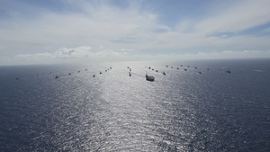 Multinational Ships sail in formation during RIMPAC 2024