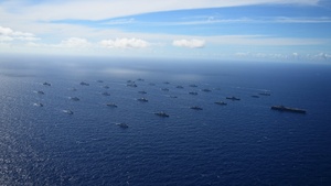 Multinational ships sail in formation during RIMPAC 2024 (wide, 4k)