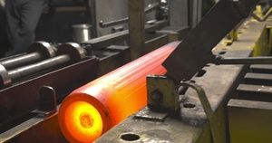 Close up of Heated and Shaped Billet Moving through Subway to Hot Inspect Process at Scranton Army Ammunition Plant