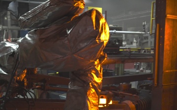 Automated Arm Removes Billet from Rotary Furnace