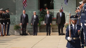 Secretary Blinken participates in a family photo and honor cordon