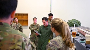 Members of the 15th Airlift Squadron plan for an upcoming mission during Bamboo Eagle 24-3