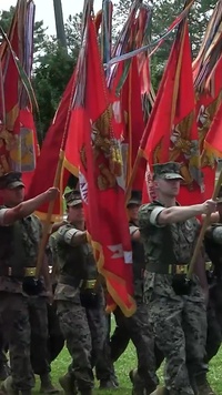 U.S. Marine Corps Gunnery Sgt. Michael Cook introduces the purpose of the 2nd MAW fight song