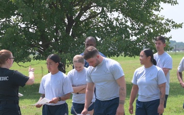 Firefighters teach service members how to decontaminate