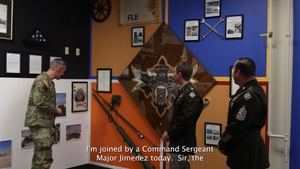 Battalions of 4th Combat Aviation Brigade present their mural displays in the Heritage Room to Maj. Gen. David Doyle and 4th Infinity Division