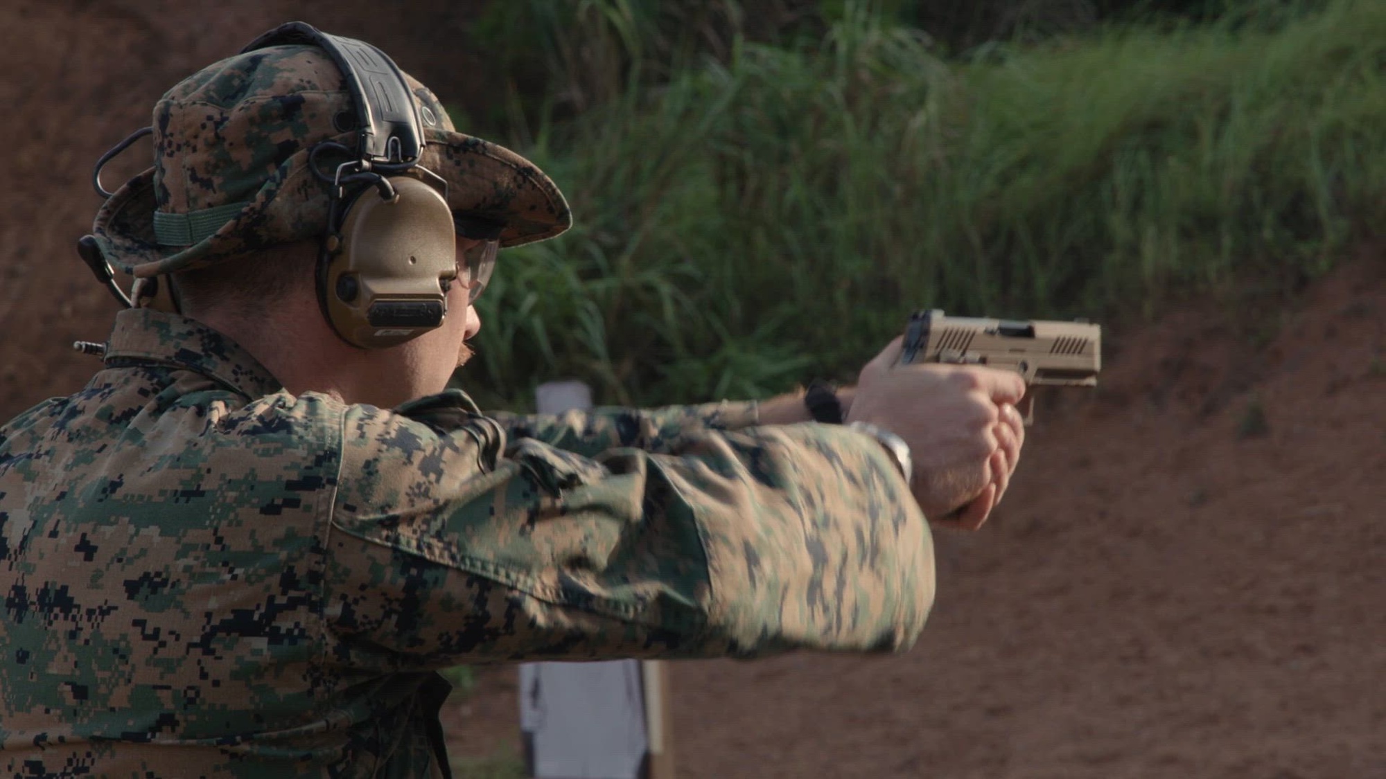 U.S. Marines with Marine Corps Base Camp Butler explosive ordnance disposal, Marine Corps Installations Pacific, conduct their annual service pistol qualification on Camp Hansen, Okinawa, Japan, Sept. 23, 2024. Marines utilized M18 service pistols during the qualification to enhance force readiness in the Indo-Pacific region. (U.S. Marine Corps video by Lance Cpl. Maksim Masloboev)