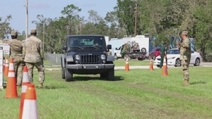 Florida Army National Guard's 53rd Brigade Support Battalion pass out water and food to civilians
