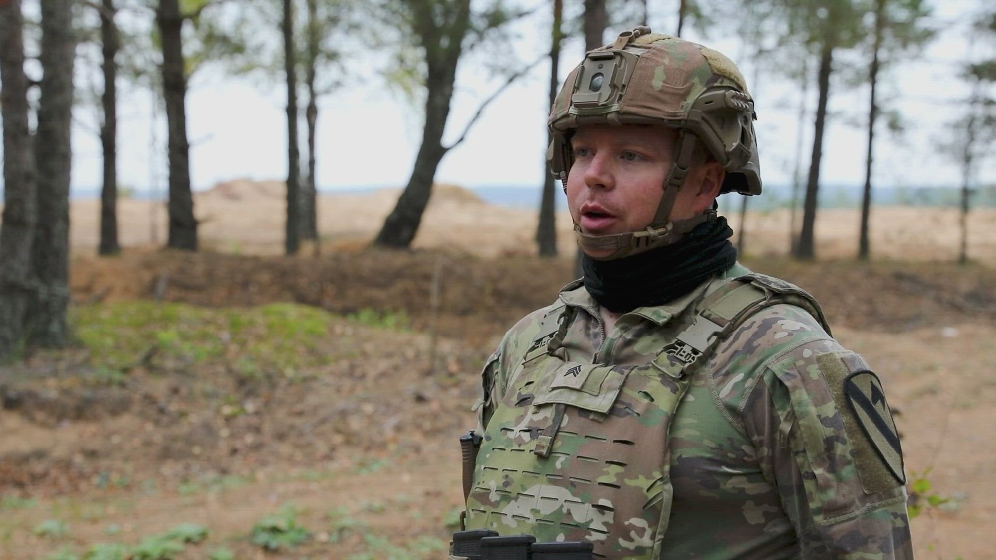 U.S. Army Sgt. Jonathan Ward, a native of Paris, Texas, and a field artillery forward observer assigned to 1st Battalion, 82nd field artillery regiment, in support of Bravo Company, 2nd Battalion, 8th Cavalry Regiment,1st Armored Brigade Combat Team, 1st Cavalry Division, discusses a fire mission training with Lithuanian soldiers during exercise Flaming Thunder at Camp Taurus, Lithuania, Sept. 25, 2024. The 1st Cavalry Division’s mission is to engage in multinational training and exercises across the continent, strengthening interoperability with NATO allies and regional security partners, which provides competent and ready forces to V Corps, America’s forward-deployed corps in Europe. (U.S. Army video by Staff Sgt. Richard Wooten)