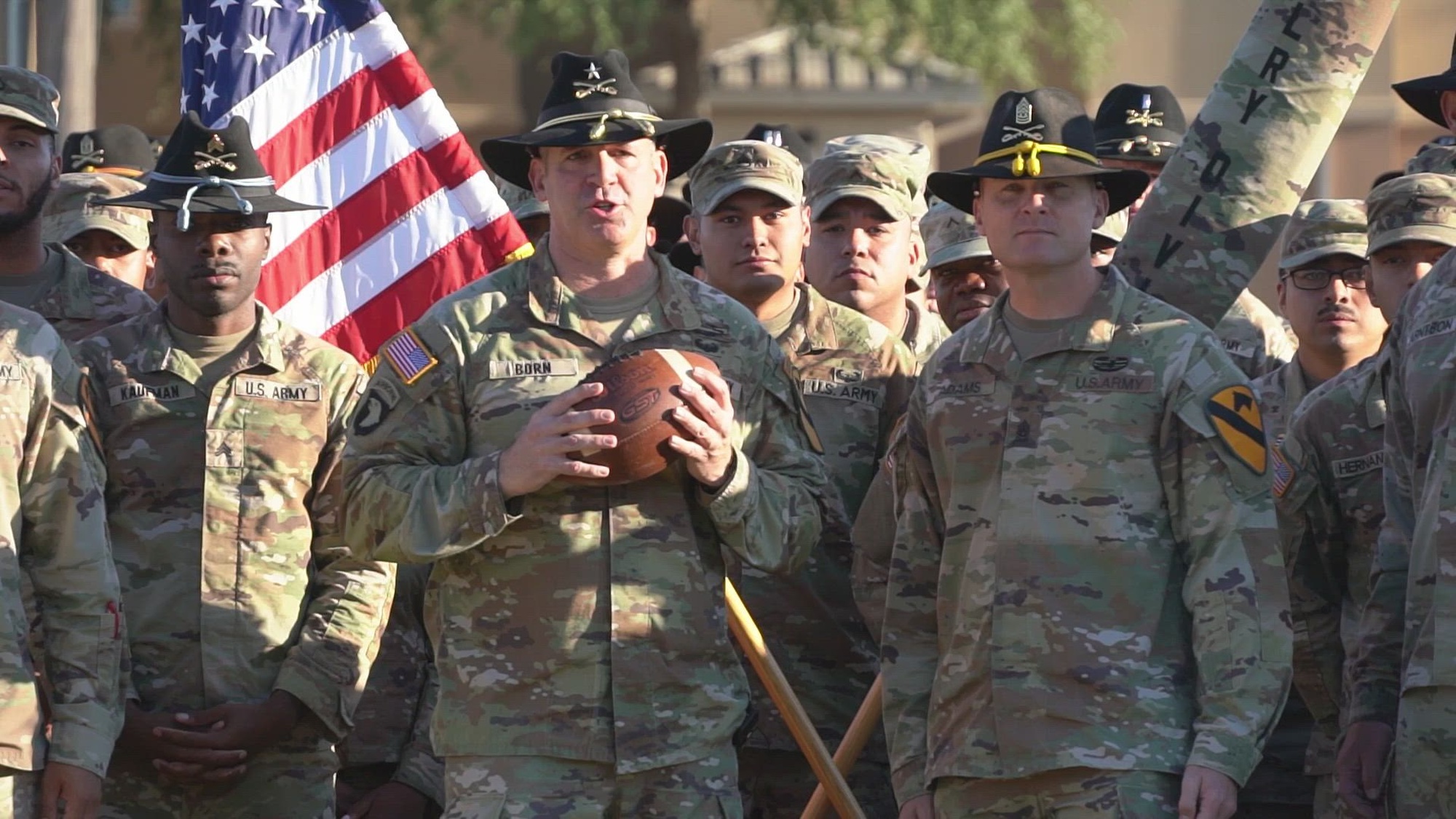Brig. Gen. Robert G. Born, the 1st Cavalry Division deputy commanding general of maneuver, and Command Sgt. Maj. Brian Adams, alongside Troopers assigned to the 1st Cavalry Division, send message of support to the Army football team on Fort Cavazos, Texas, Sept. 27th, 2024. The football game is scheduled for Nov. 9th, 2024 at University of North Texas. (U.S. Army video by Sgt. Lyca Williams)