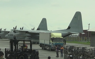 III Marine Expeditionary Force, Philippine Air Force load equipment for transport to support humanitarian relief efforts