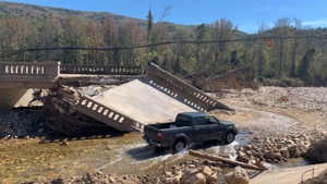 Truck crosses North Fork of the Catawba River from Hurricane Helene damage