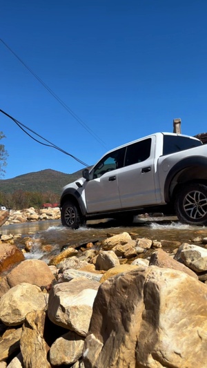Truck Crosses River Under Broken Bridge in Marion, N.C.