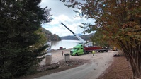 Crews construct floating platform for Lake Lure debris removal