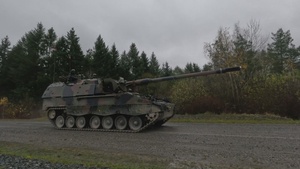 Italian Army PZH2000s roll off the range upon completion of live fires during Dynamic Front 25