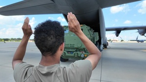 Pope AAF Airmen, Army Soldiers Partner to Load HIMAR Weapon System