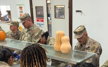 17th Sustainment Brigade command team serve Thanksgiving dinner to Soldiers