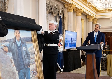 Secretary of State Antony J. Blinken delivers remarks at a portrait unveiling of the 68th Secretary of State John Kerry at the Department of State