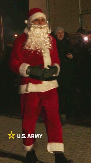 U.S. Soldiers and Members of The NATO Multinational Battlegroup Attend a Christmas Tree Lighting Event