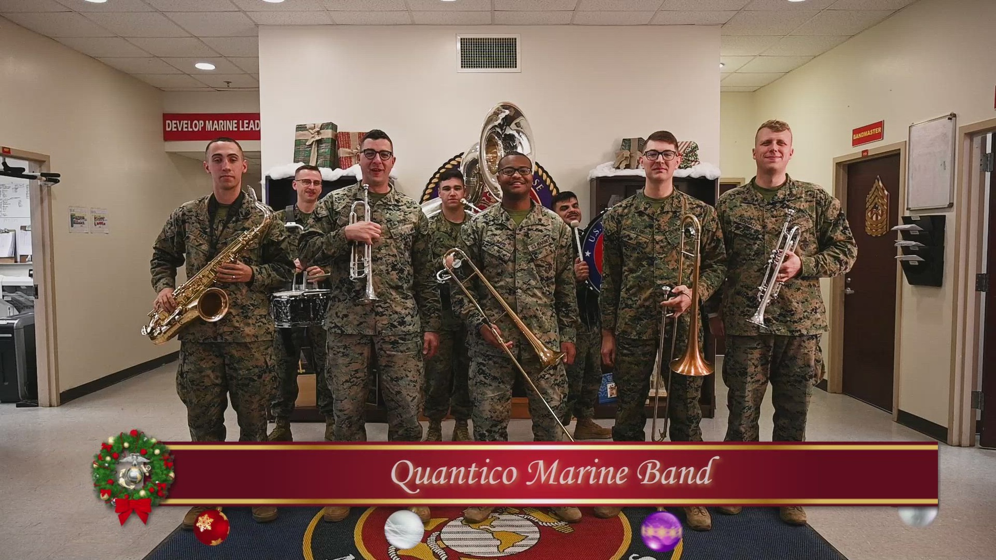 Members of the Quantico Marine Band, Sexual Assault Prevention and Response representatives, Amanda Pool and Mary Langway, and the Marine Corps Marathon Office staff deliver a base-wide holiday message on Marine Corps Base Quantico, Dec. 6, 2024. The holiday message intends to spread glee across the base during the season of cheer. (U.S. Marine Corps video by Lance Cpl. Catherine Schei) 