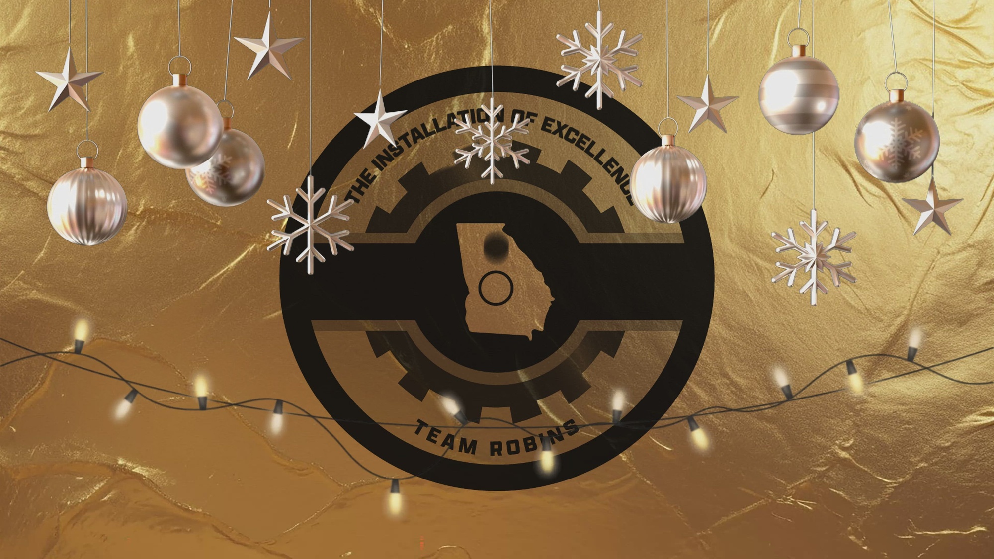 Thumbnail of video shows Team Robins logo on gold background with gold Christmas ornaments and lights.