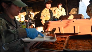 USAF Reserve 944th Fighter Wing line up for hot meals at Exercise Desert Hammer
