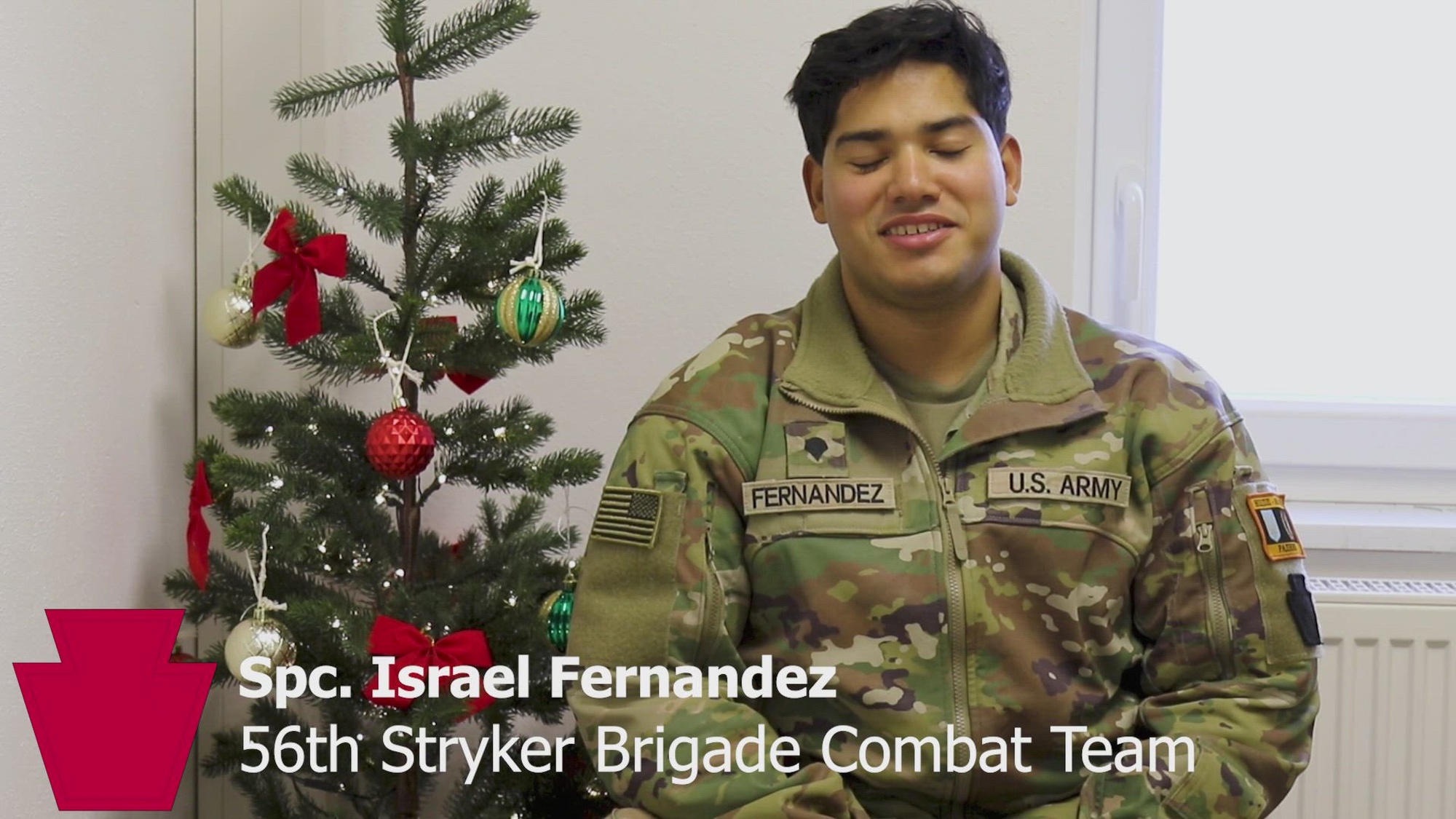 U.S. Army Spc. Israel Fernandez with the Headquarters and Headquarters Company, 56th Stryker Brigade Combat Team, 28th Infantry Division, Pennsylvania National Guard shares a holiday message from Grafenwoehr, Germany, December 2024. (Army National Guard video by Capt. Leanne Demboski)