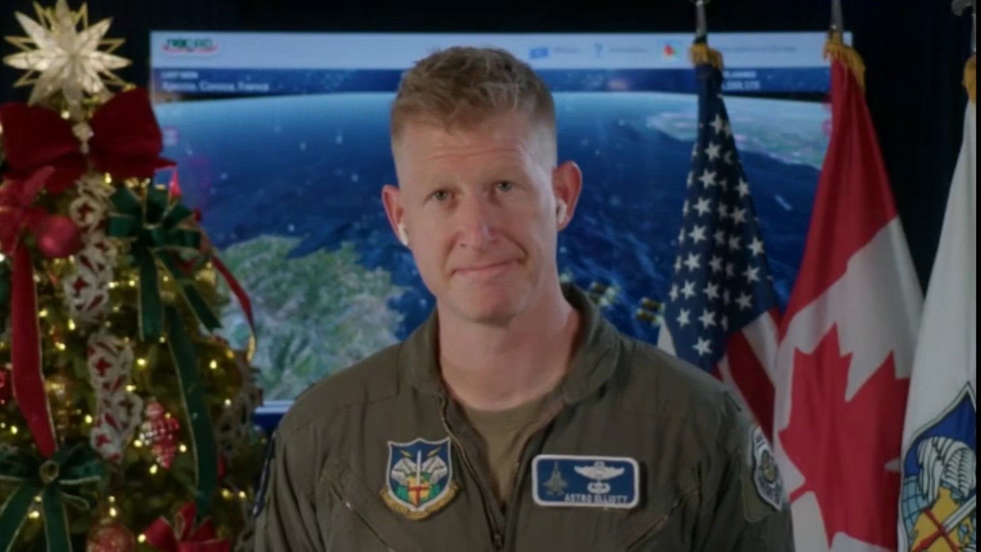 Col. Justin Elliott talks to a reporter from WMBB-TV about the 2024 NORAD Tracks Santa event.