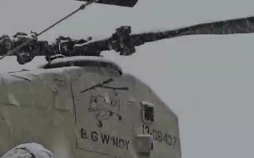 Snow falls on CH-47F Chinook Helicopters at Katterbach Army Airfield