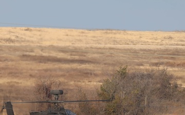 M2A3 Bradley Fighting Vehicle and Boeing AH-64 Apache Attack Helicopter engages targets during 3ABCT/1CD CALFEX ×