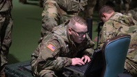 10th Mountain, 11th Airborne Division Soldiers perform radio operations