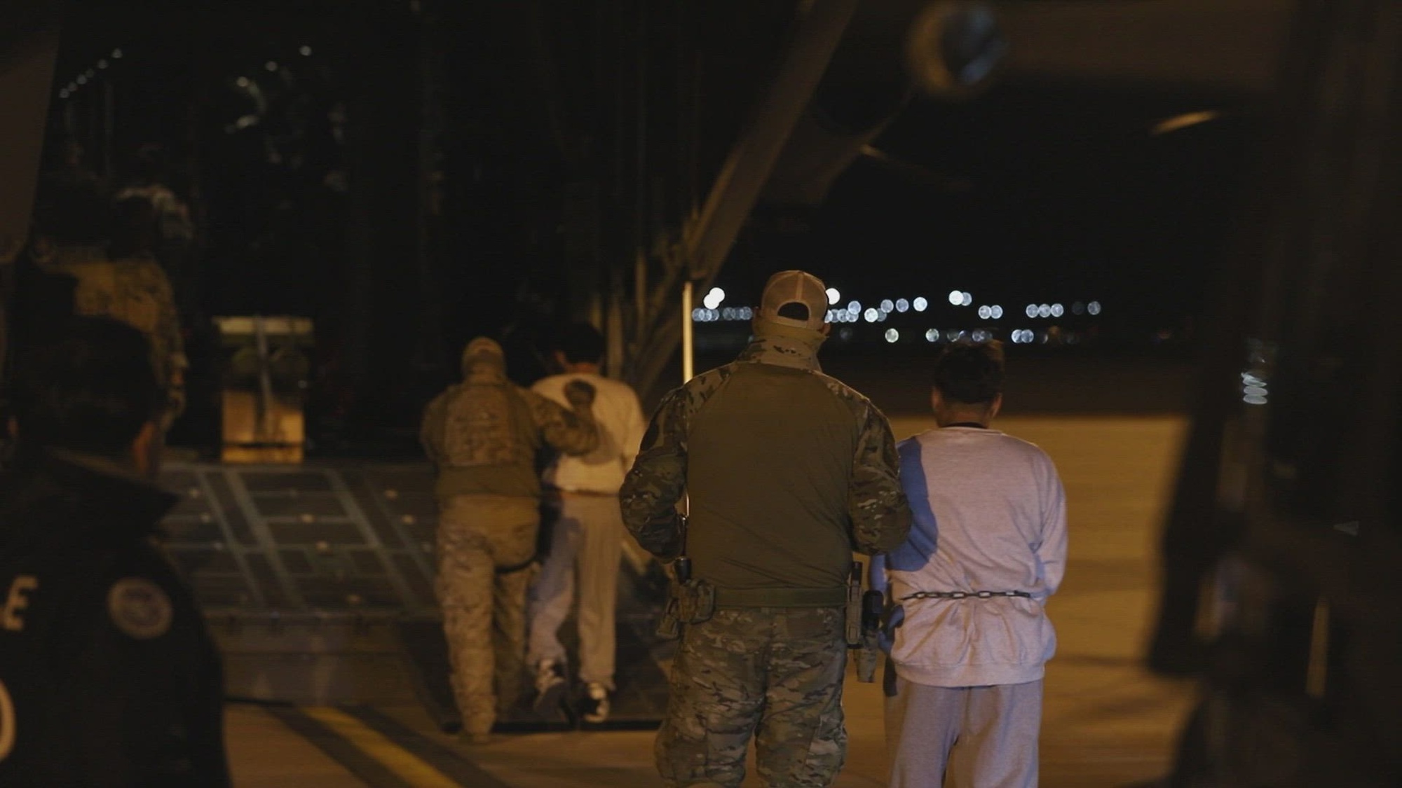 U.S. Immigration and Customs Enforcement in coordination with the U.S. Customs and Border Protection assist with deportation of illegal aliens at Biggs Army Airfield, Fort Bliss, Texas, Feb. 12, 2025. Under the direction of U.S. Northern Command, U.S. Transportation Command is supporting Immigration and Customs Enforcement removal flights by providing military airlift. (Dept. of Defense video by Cpl. Adaris Cole)