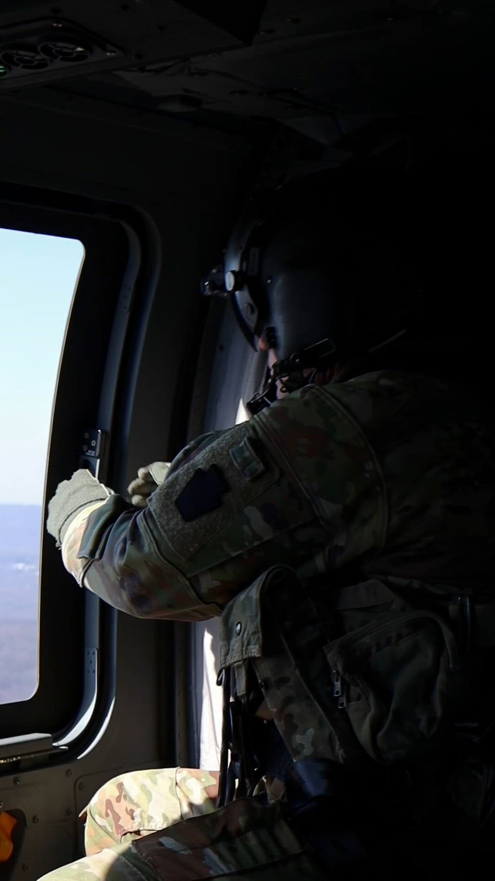U.S. Soldiers with Charlie Company, 2-104th General Support Aviation Battalion, 28th Expeditionary Combat Aviation Brigade, 28th Infantry Division, fly in a UH-60 Black Hawk Helicopter from Fort Indiantown Gap, Pennsylvania to Richmond, Virginia, Feb. 22, 2025. The Soldiers trained with night vision goggles during their night flight training. (U.S. Army National Guard video by Cadet Jessica Barb)