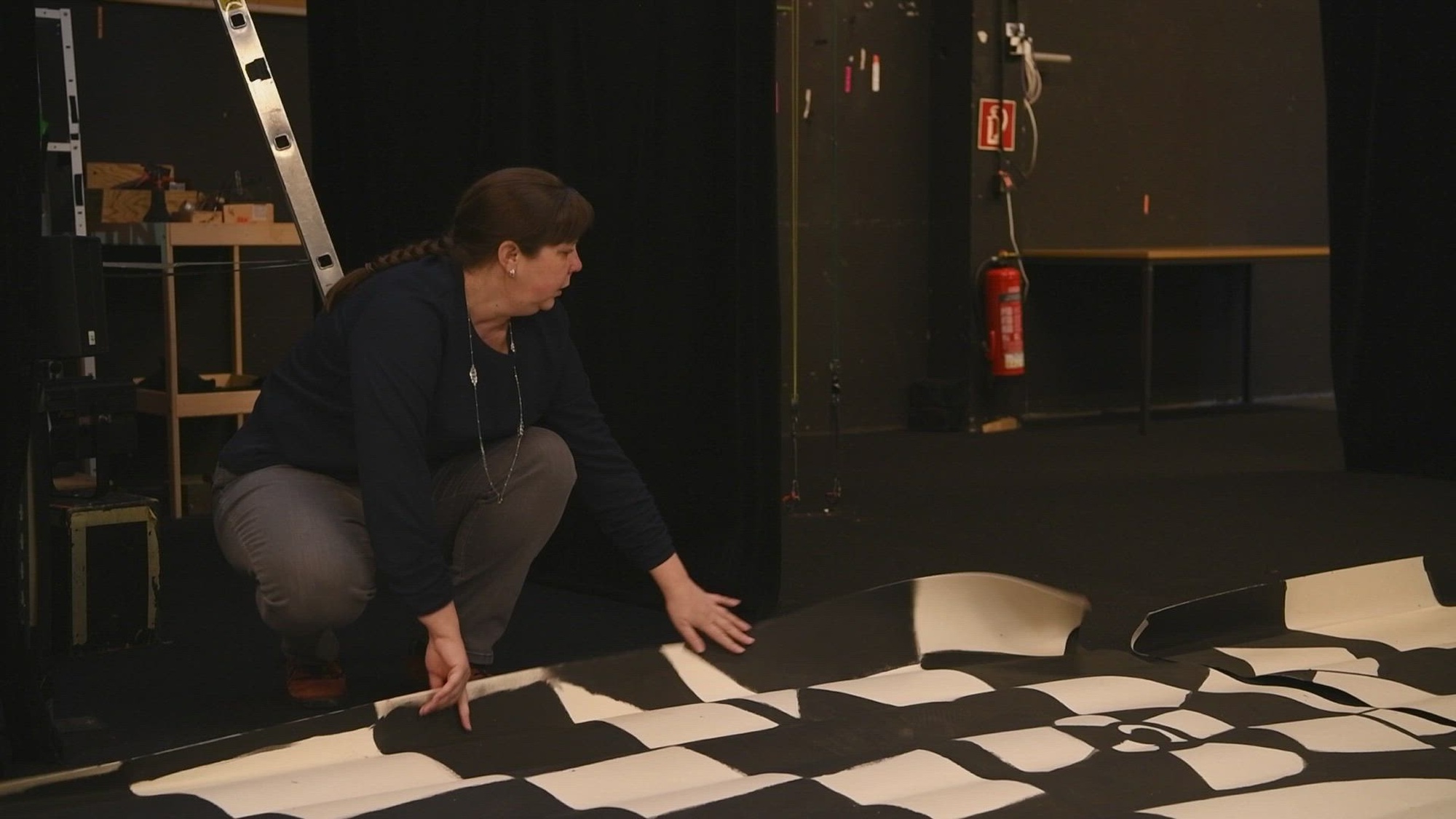 Amelia Earhart Playhouse theater director Autumn Mann, AEP marketing assistant Christina Shannon, and Disney’s Alice in Wonderland JR. co-director Kelly O’Donnell moved thirty-two child actors and dozens of props and set pieces to Velvets Theater in Wiesbaden, Germany. Mann created a partnership with the local puppet theater to share their stage while the Playhouse moves from the Amelia Earhart building to their new space in the abandoned strip mall on lower Hainerberg Kaserne. (U.S. Army video by Sgt. Kevin Dunnaway)