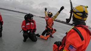 U.S. Coast Guard Station Manistee and Air Station Traverse City conduct cooperative ice rescue training Lake Michigan