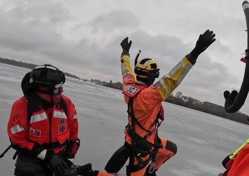U.S. Coast Guard Station Manistee and Air Station Traverse City conduct cooperative ice rescue training Lake Michigan
