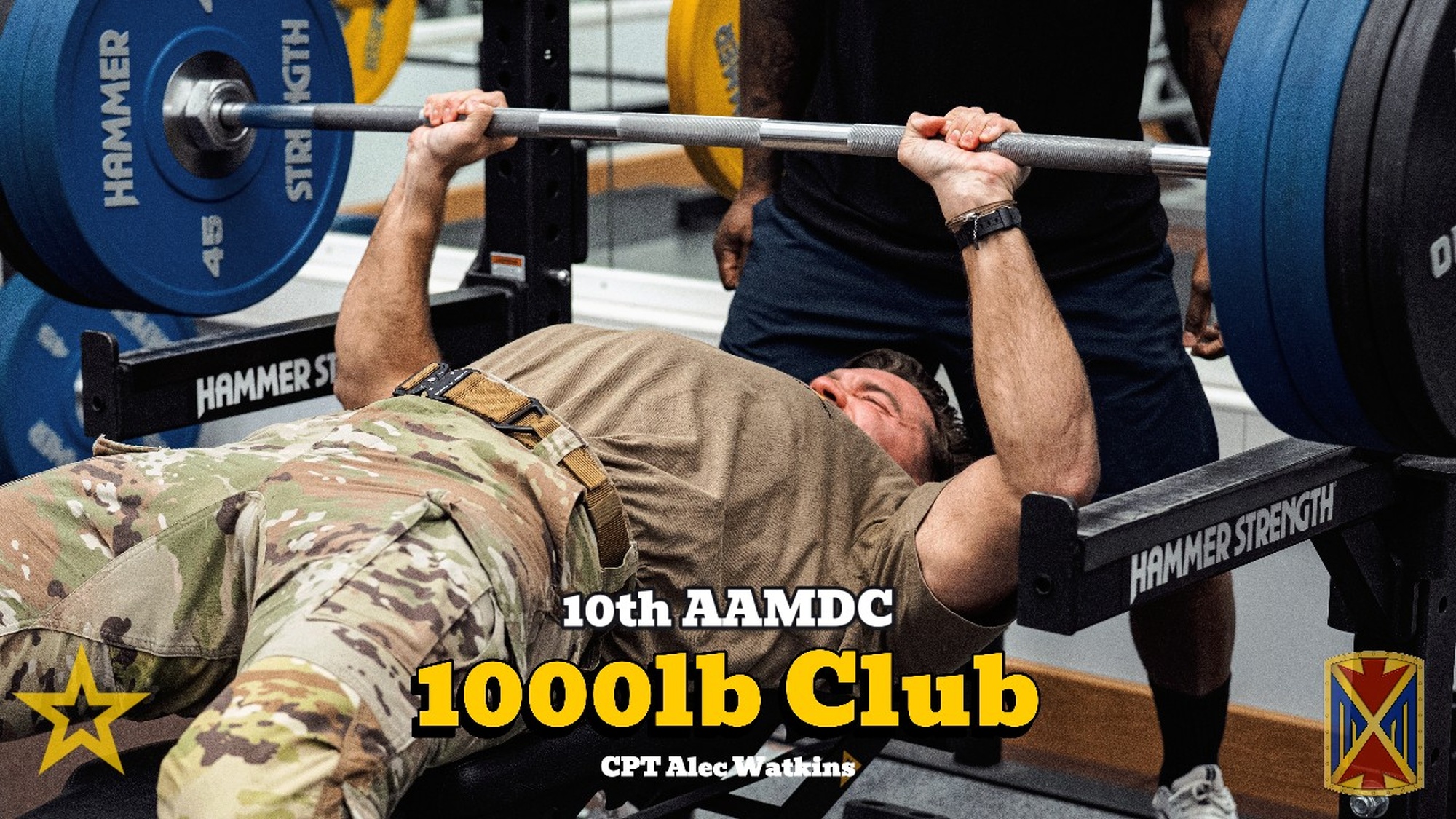 U.S. Army Capt. Alec Watkins, 10th Army Air and Missile Defense Command public affairs officer, joins the 1000 Pound Club Mar. 12, 2025, at Sembach Kaserne, Germany. The 1000 Pound Challenge consists of three barbell workouts with a 1000 consecutive pound goal and a 1 hour time limit, with an alternative 500 pound goal (U.S. Army Video by Pfc. Luis Jimenez).
