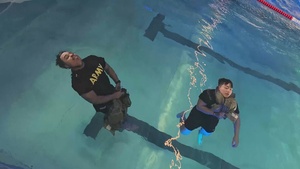 U.S. Soldiers complete the Combat Water Survival lane in the Medical Readiness Command EUR Best Leader Competition