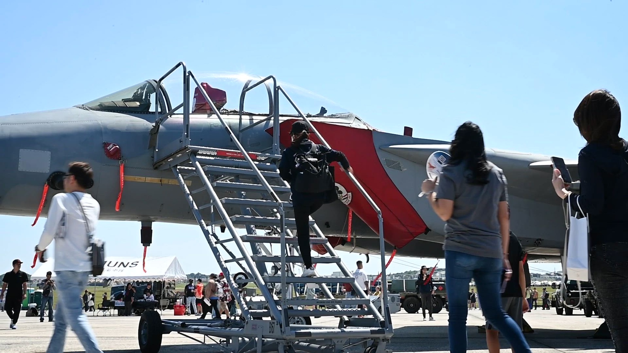 Festival attendees tour static aircraft, speak with service members, enjoy live entertainment and eat during America Fest at Kadena Air Base, Japan, March 22/23, 2025. America Fest is Kadena Air Base’s open house event where attendees viewed static aircraft displays, interacted with U.S. service members and enjoyed a wide variety of entertainment and activities. (U.S. Air Force video by Senior Airman Alexis Redin)