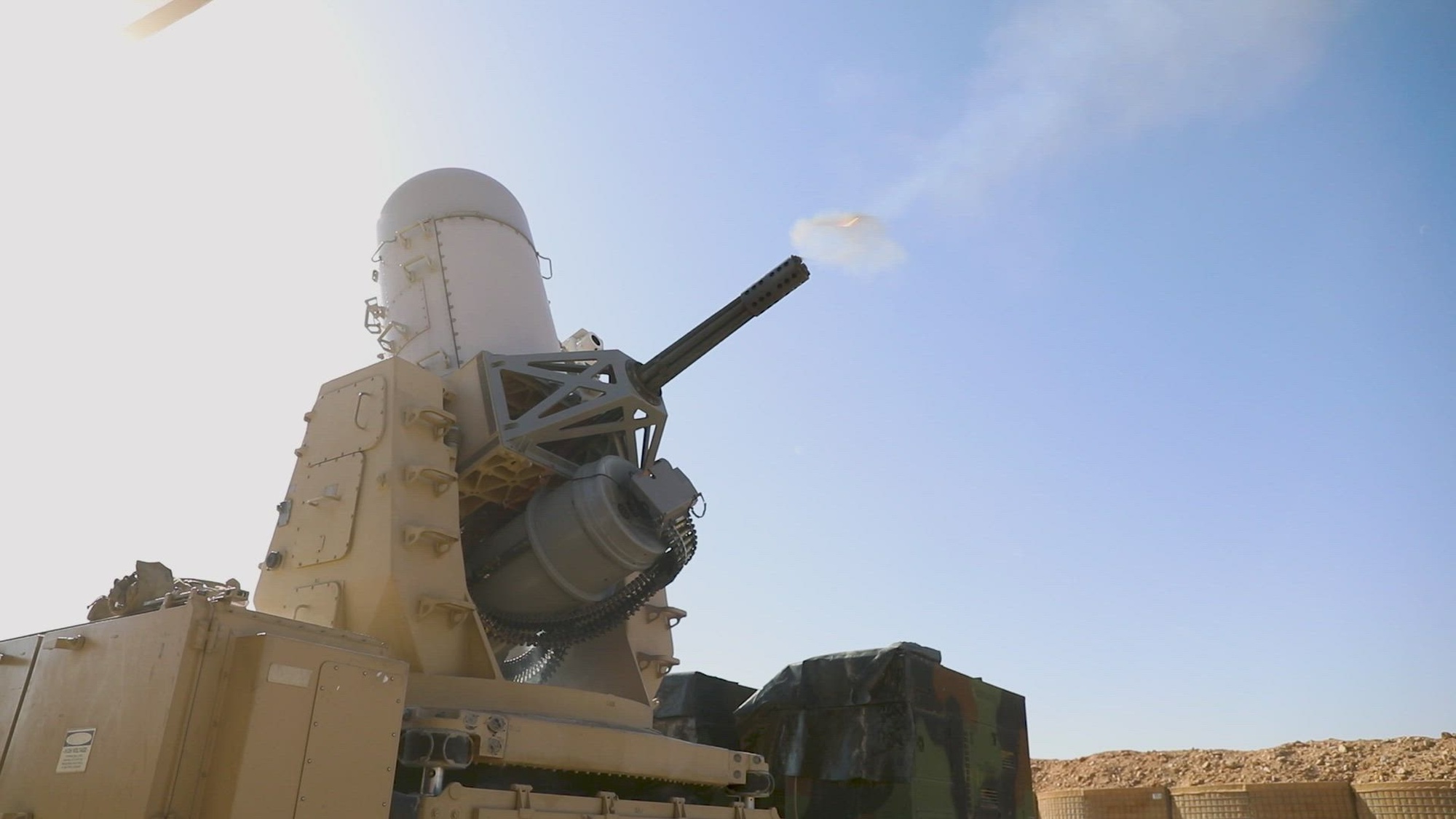 A 20mm Land-Based Phalanx Weapon System, operated by the 218th Field Artillery Regiment, attached to Task Force Armadillo, fires a Pre-Action Calibration Firing (PACFIRE) exercise at Al-Tanf Garrison, Syria, on March 24, 2025. The PACFIRE exercise calibrates the entire system to ensure that rounds fired are more accurate and on target during engagements. After firing, the machine also went through clearing and cleaning operations to maintain its operational readiness and ensure safety. Combined Joint Task Force - Operation Inherent Resolve will optimize defense capabilities to protect Coalition Forces while supporting partner forces.